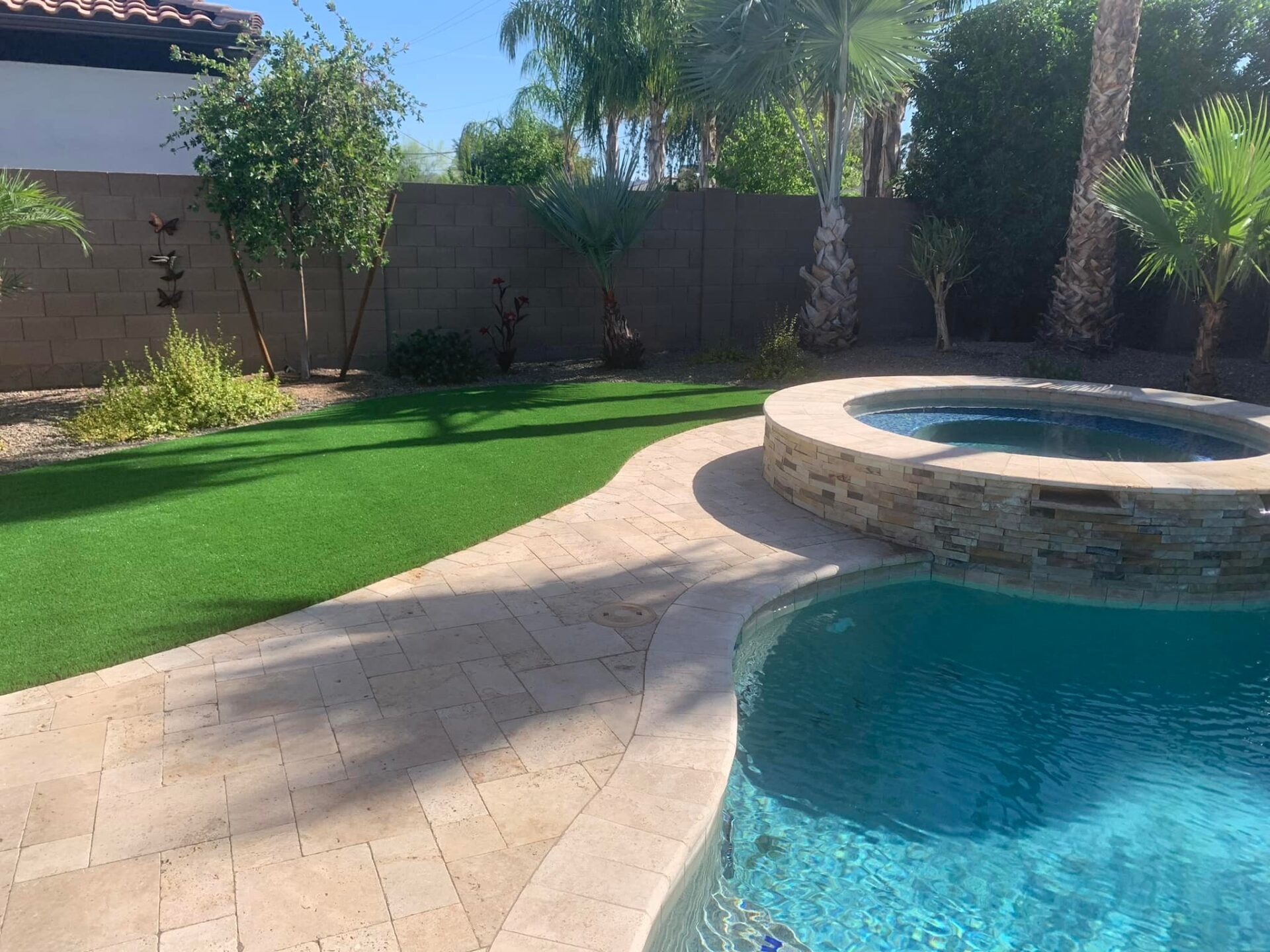 The Ultimate Guide to Poolside Design with Artificial Grass and Pavers
